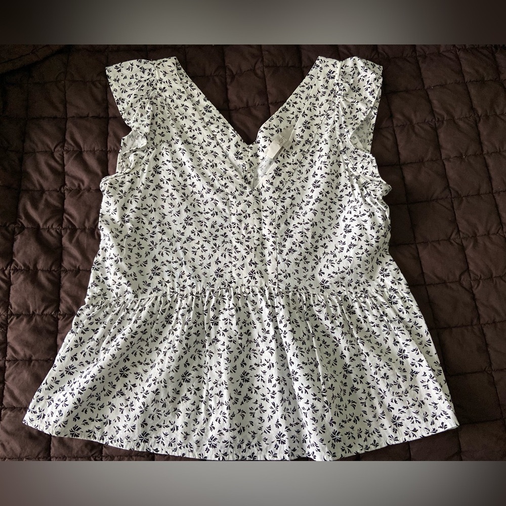 Black and white floral peplum top with ruffle sleeve
